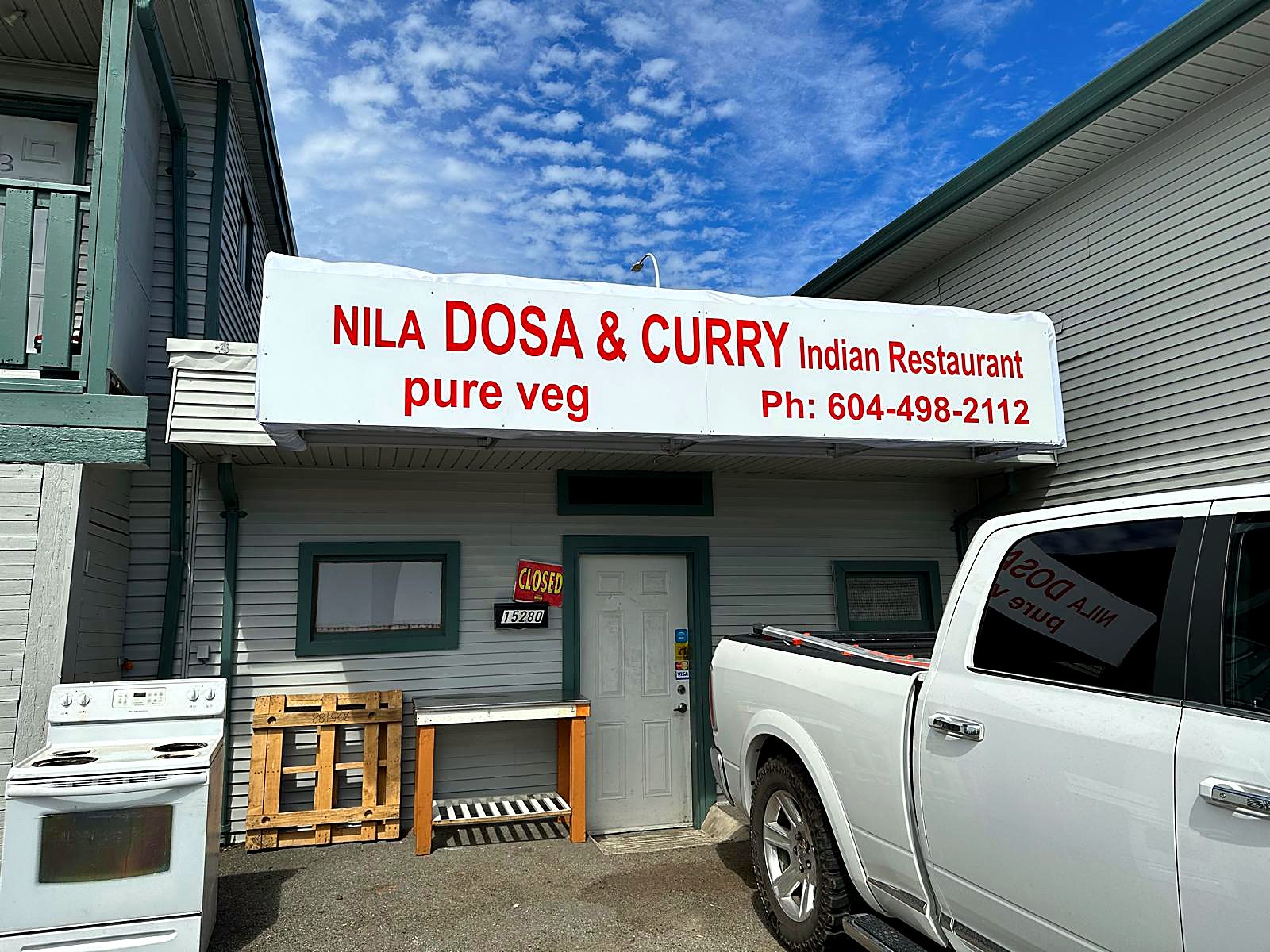 Nila Dosa & Curry storefront sign